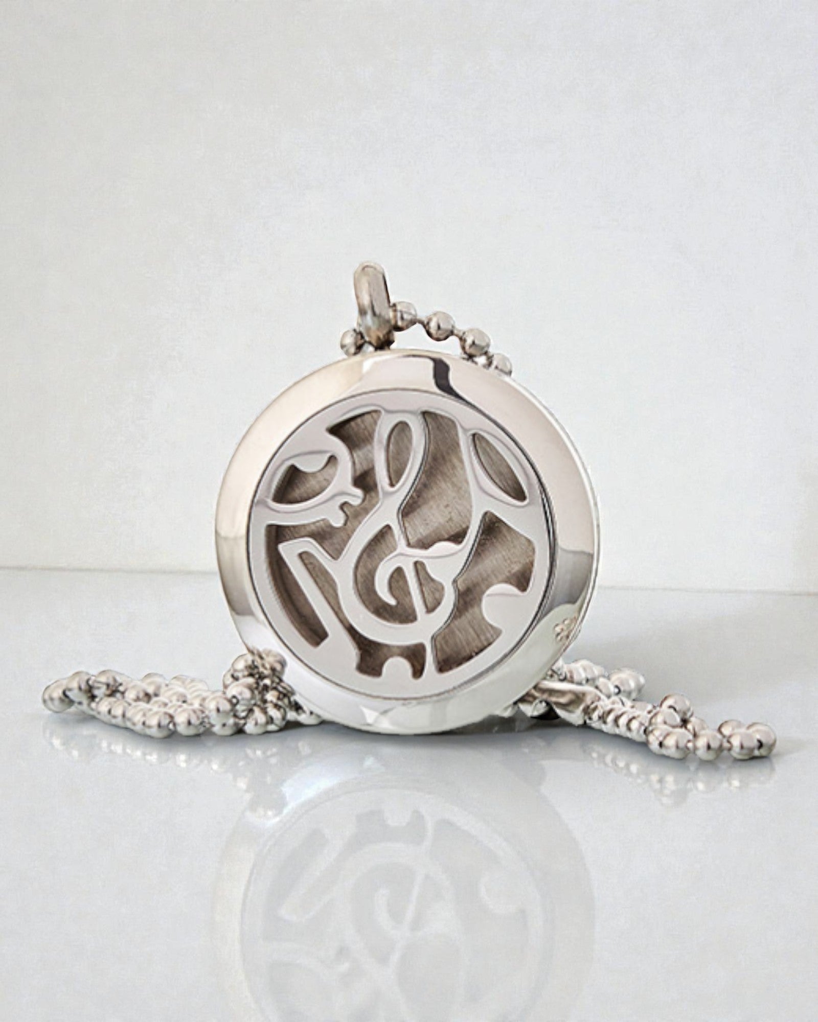 Doftsymfoni – aromaterapeutiskt halsband med motiv av musiknoter 25 mm