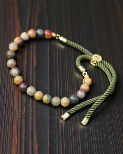 Moss Aura – Armband med Picasso-jaspis och 18K guld på grön snodd
