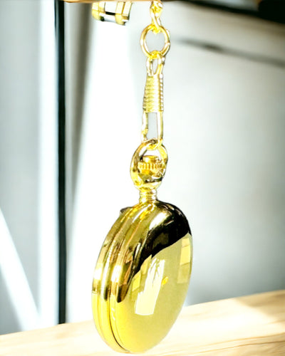 Fickur i guld med möjlighet till gravyr